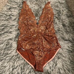 HAH coming in HAHt lace bodysuit XS